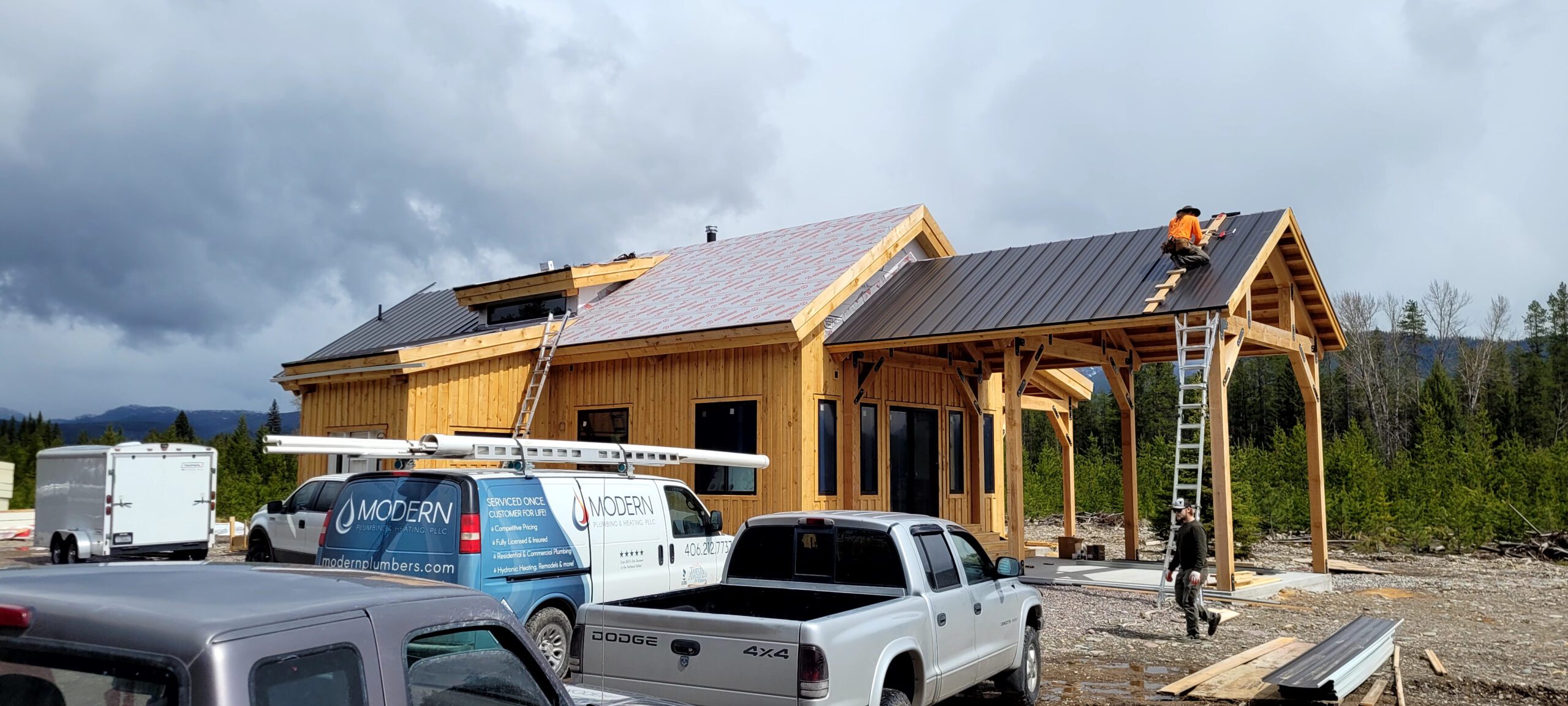 roofing contractor installing metal roof