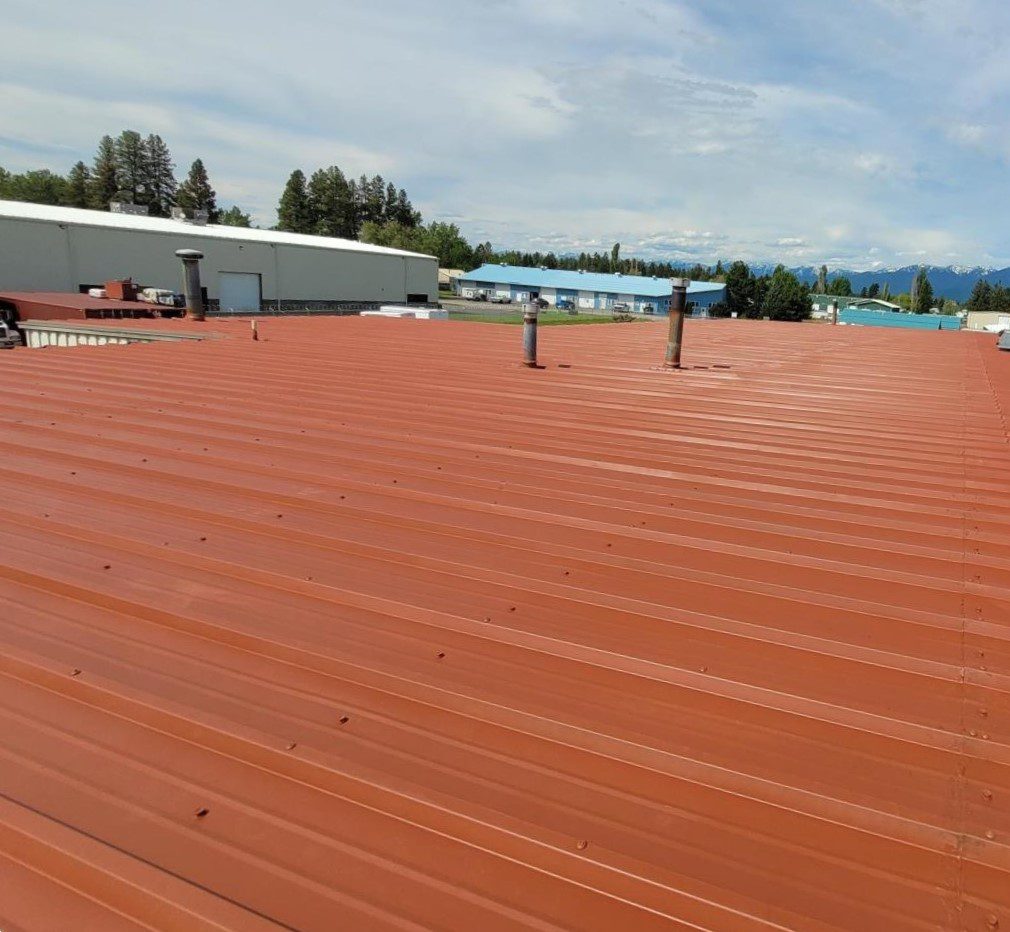 A metal roof with a fluid applied roofing protective coating