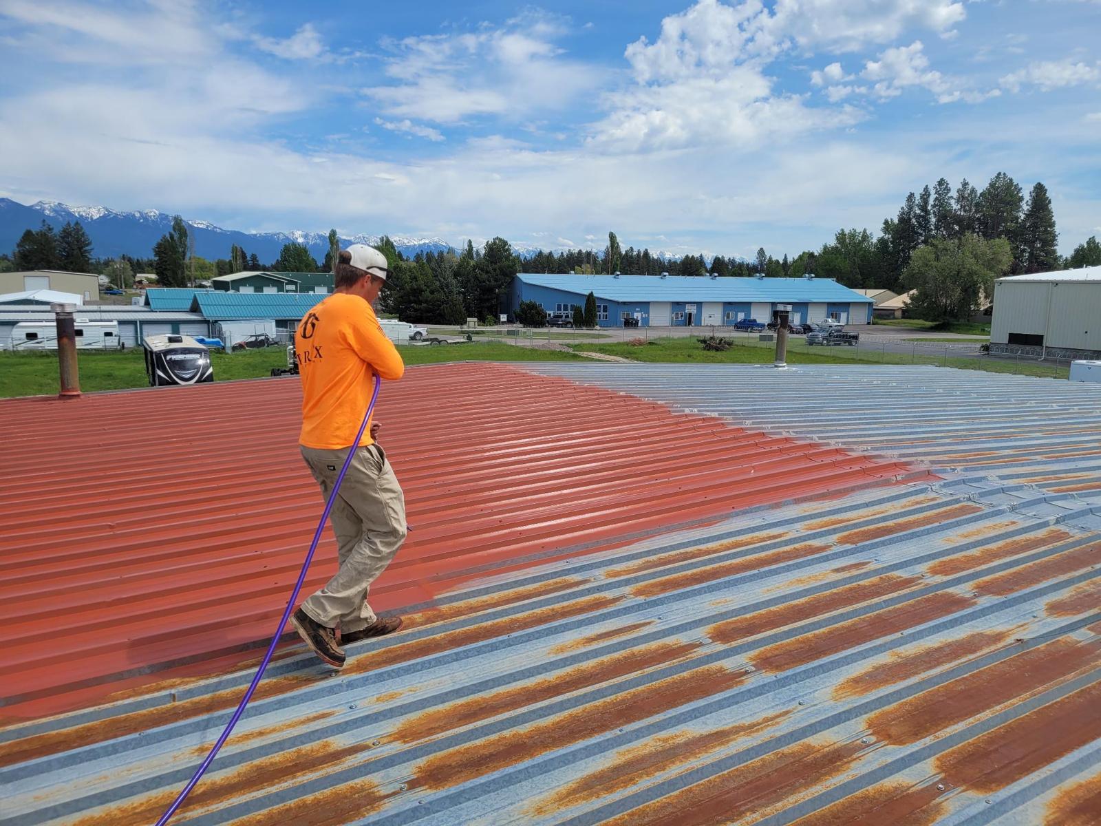 A certified Brix Systems roofing contractor installing Fluid Applied Roofing on a metal roof
