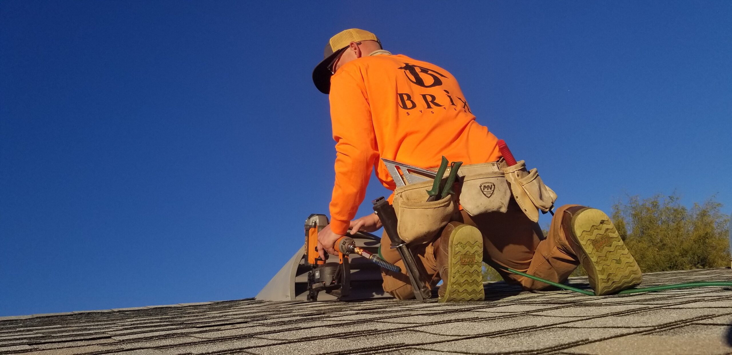 Brix Systems Roofing Contractor repairing a roof
