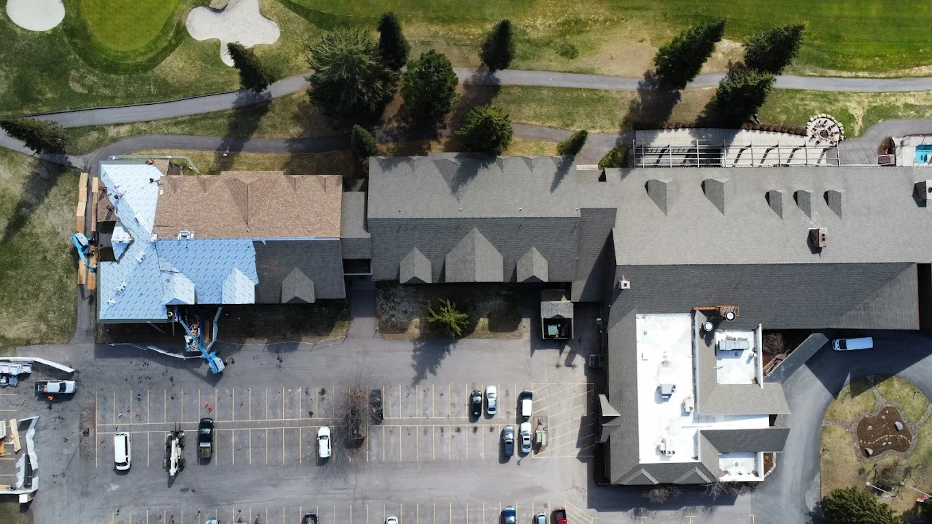 Birdseye view of an apartment roof being replaced by montana roofers
